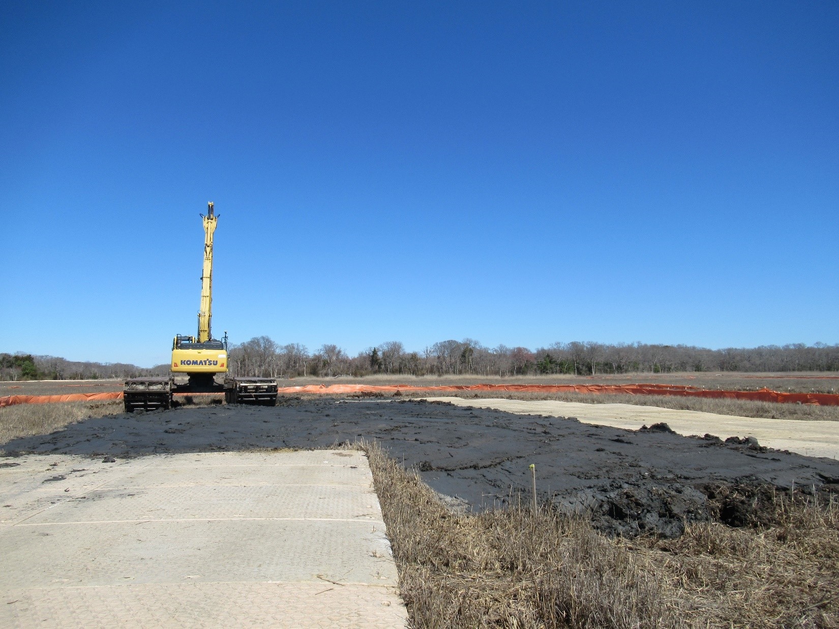 Building a high marsh island within the marsh interior with material excavated from constructed tributaries – March 2025